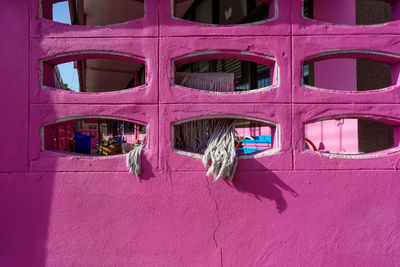 Full frame shot of pink window on building