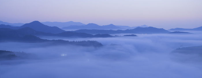 Scenic view of mountains against sky during sunset