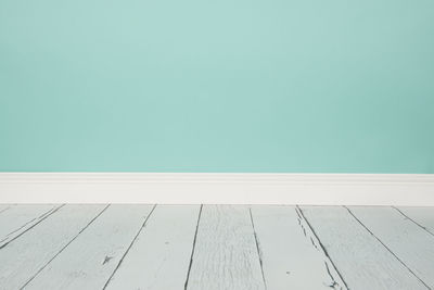 High angle view of wooden table against clear blue sky