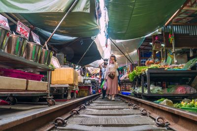 Rear view of people at market stall