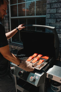 Cropped hand of man preparing food