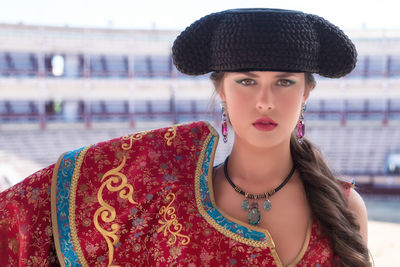 Portrait of young woman wearing hat