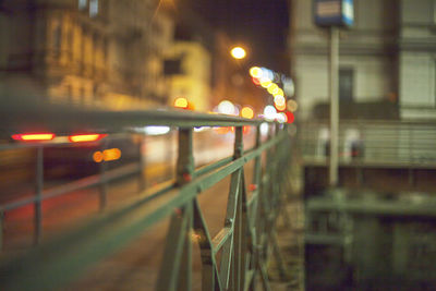 Train at railroad station platform at night