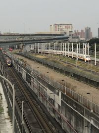 High angle view of train in city against sky