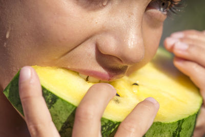 Close-up of girl eating melon