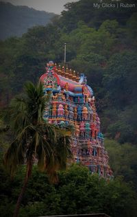 View of temple building against mountain