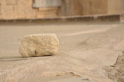 Close-up of stones on sand