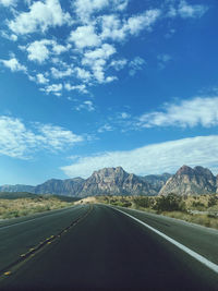 Empty road against sky