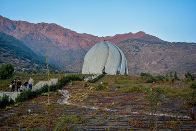 Scenic view of landscape and mountains against clear sky