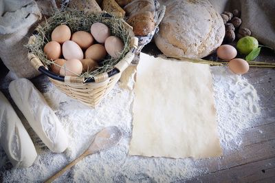 High angle view of eggs in basket on table