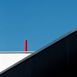 Red structure against clear blue sky