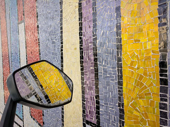 Close-up of yellow wall with windows