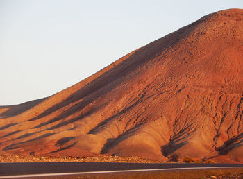 Scenic view of desert against clear sky