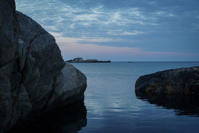 Scenic view of sea against sky at sunset