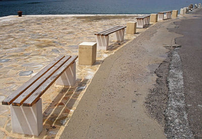 Benches in the row on coastal walkway