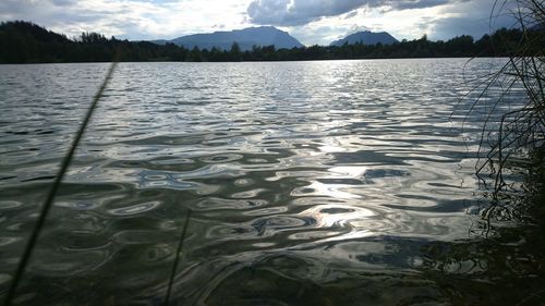 Scenic view of lake with mountains in background