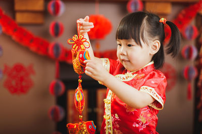 Portrait of cute girl in traditional clothing