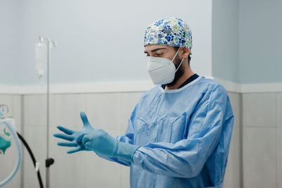 Portrait of senior man standing in corridor