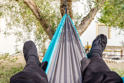 Low section of woman in hammock