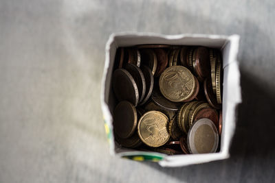 Directly above view of cents in box on table