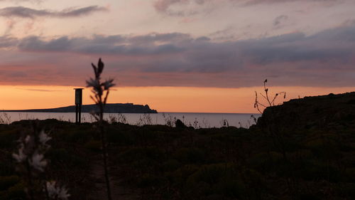 Scenic view of sea at sunset