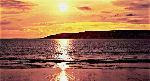 Scenic view of sunset over sea