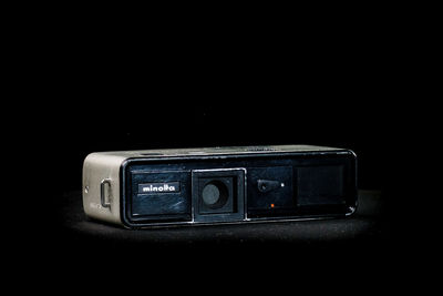 Close-up of vintage car on table against black background