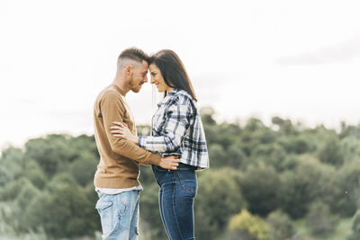 Young couple standing outdoors