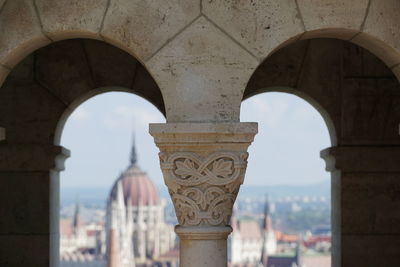 Buildings seen through arch