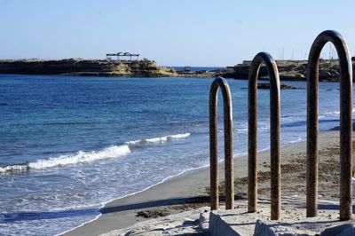 Scenic view of beach against clear sky