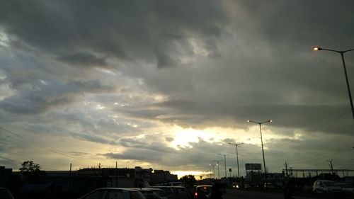 Road against cloudy sky at sunset
