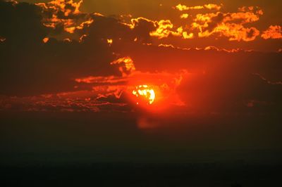 Scenic view of dramatic sky during sunset