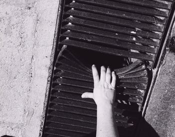 Close-up of woman standing on wall