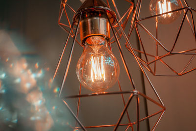 Close-up of illuminated light bulb