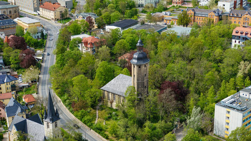 High angle view of street amidst buildings in town