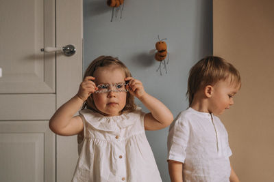 Toddler twins having fun in the room. children play in the room