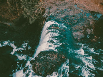 High angle view of waterfall in sea