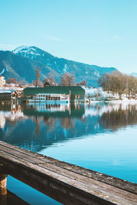 Picturesque fishing village on the coast of the lake tegernsee. pier in alpine mountains, bavaria.