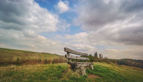 Built structure on field against sky