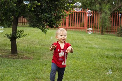 Portrait of happy girl playing in park