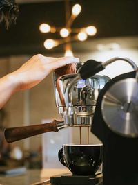 Cropped hand of man holding coffee