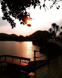 Scenic view of lake at sunset