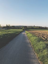 Scenic view of agricultural field against clear sky