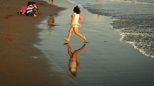 Reflection of people in water
