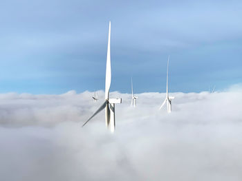 Wind turbine over the clouds