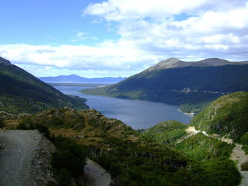 Scenic view of lake and mountains against sky