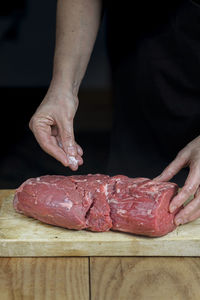 Midsection of man preparing food