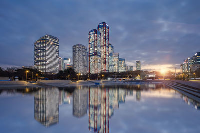 Reflection of illuminated buildings in water
