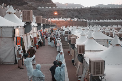 High angle view of people in religious events by tents