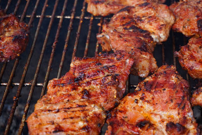 High angle view of meat on barbecue grill